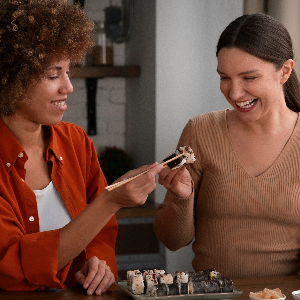 medium-shot-women-learning-make-sushi